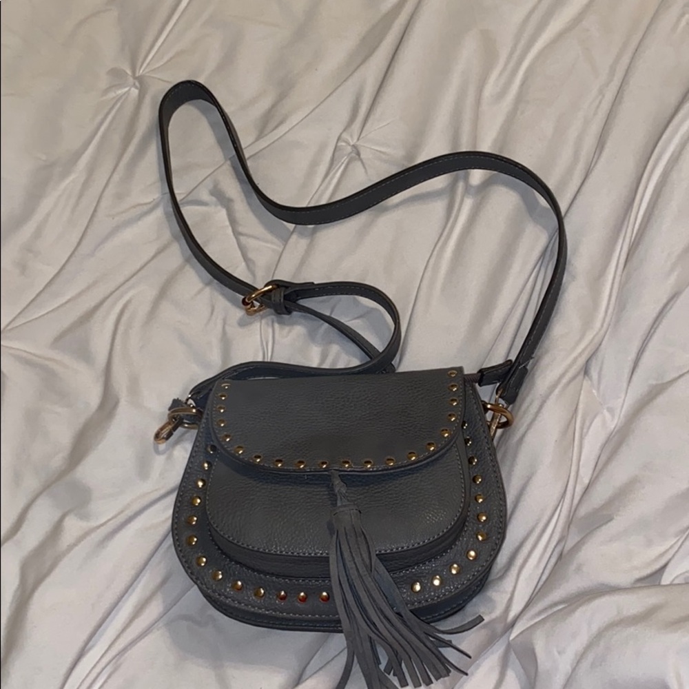 gray purse with gold stones around it